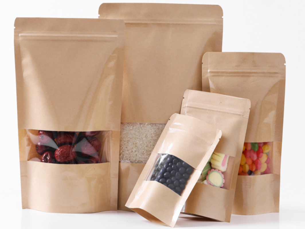 Front view of resealable kraft paper pouch with clear window showing snacks inside