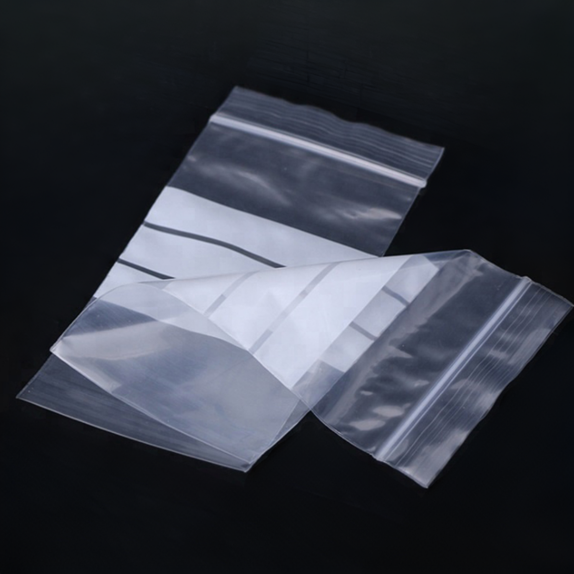 Close-up of white write-on panel on clear grip seal zip lock bag for easy labeling